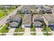 Aerial view of well-maintained homes featuring manicured lawns and tree-lined streets at 30364 Marquette Ave, Wesley Chapel, FL 33545