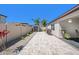 Beautiful backyard with a brick-paved patio, stone landscaping, and well-manicured plants at 30364 Marquette Ave, Wesley Chapel, FL 33545