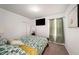 Bedroom featuring neutral walls, carpet flooring, closet, and bright natural lighting at 30364 Marquette Ave, Wesley Chapel, FL 33545