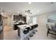 Well-equipped kitchen with a breakfast bar, stainless steel appliances, and modern finishes at 30364 Marquette Ave, Wesley Chapel, FL 33545
