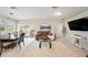 Open-concept living room with modern decor and a sliding glass door to the patio at 30364 Marquette Ave, Wesley Chapel, FL 33545