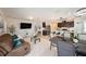 Open-concept living space featuring a kitchen with a breakfast bar, dining area, and comfortable living area at 30364 Marquette Ave, Wesley Chapel, FL 33545