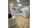 Functional kitchen with white cabinets and modern appliances, offering ample space and natural light at 3204 W Clinton St, Tampa, FL 33614