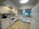 Well-equipped kitchen with white appliances and granite countertops, perfect for everyday cooking at 3204 W Clinton St, Tampa, FL 33614