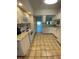 Efficient kitchen design with granite countertops, modern appliances, and an adjacent dining area at 3204 W Clinton St, Tampa, FL 33614