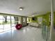 Spacious living room showcases tile flooring, comfortable seating, and scenic views of the lake at 3204 W Clinton St, Tampa, FL 33614