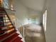 Spacious living room featuring a high ceiling, neutral colors, and staircase at 3204 W Clinton St, Tampa, FL 33614