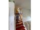 Unique staircase design with open landing, complemented by bright, natural lighting at 3204 W Clinton St, Tampa, FL 33614