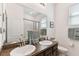 Well-lit bathroom featuring double sinks, a large mirror, and a shower/tub combo, providing a functional and stylish space at 32853 Woodthrush Way, Wesley Chapel, FL 33545