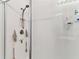 This bathroom features a walk-in shower with built in shelves at 32853 Woodthrush Way, Wesley Chapel, FL 33545