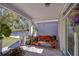 Charming front porch with wood bench and decorative plants at 37362 Dixie Ave, Dade City, FL 33525