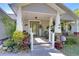 Inviting front porch with seating and decor at 37362 Dixie Ave, Dade City, FL 33525