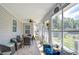 Covered outdoor patio with seating and views of the backyard at 37362 Dixie Ave, Dade City, FL 33525