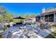 Expansive backyard with concrete patio, outdoor seating, umbrellas, and shade, ideal for entertaining at 37410 Dixie Ave, Dade City, FL 33525