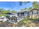Spacious backyard with patio furniture, grill, and a well-maintained lawn, perfect for outdoor activities at 37410 Dixie Ave, Dade City, FL 33525