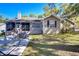Inviting backyard with screened porch, patio area, and outdoor seating, perfect for relaxing at 37410 Dixie Ave, Dade City, FL 33525