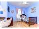 Cozy bedroom features a ceiling fan, hardwood floors, and pink accents at 37410 Dixie Ave, Dade City, FL 33525