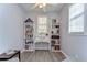 Bright office space with bookshelves, a desk, and plenty of natural light at 37410 Dixie Ave, Dade City, FL 33525