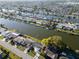 Beautiful waterfront community with well-maintained homes and easy access to the water, aerial view at 3814 Sunray Dr, Holiday, FL 34691