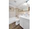 Clean bathroom featuring a shower-tub combo, toilet, and vanity with sink at 3814 Sunray Dr, Holiday, FL 34691