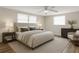 Comfortable bedroom with a large bed, neutral tones, and modern furnishings and decor at 3814 Sunray Dr, Holiday, FL 34691