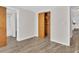 This bedroom features an ensuite bathroom and closet with wood paneling and shelving at 3814 Sunray Dr, Holiday, FL 34691