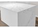 Elegant kitchen island featuring marble countertop and streamlined design at 3814 Sunray Dr, Holiday, FL 34691