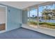 Enclosed lanai with serene water views, perfect for relaxing and enjoying the outdoors at 3814 Sunray Dr, Holiday, FL 34691