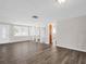 Bright living room featuring new flooring and neutral wall color at 3814 Sunray Dr, Holiday, FL 34691