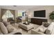 Bright and airy living room with modern furniture, decor, and view of the outdoors at 3814 Sunray Dr, Holiday, FL 34691