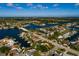 Waterfront property with mature trees, a boat dock and a pool, near a bridge to the open bay and Gulf at 3960 13Th Ne Way, St Petersburg, FL 33703