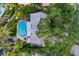 Aerial shot of the property showcasing the pool, lush landscaping, and the home's overall layout at 3960 13Th Ne Way, St Petersburg, FL 33703
