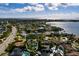Waterfront property featuring a pool and dock in a scenic neighborhood, offering direct access to the water at 3960 13Th Ne Way, St Petersburg, FL 33703