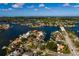 Waterfront property with mature trees, a boat dock and a pool, near a bridge to the open bay and Gulf at 3960 13Th Ne Way, St Petersburg, FL 33703
