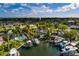 Aerial view of a waterfront property featuring a private dock and swimming pool at 3960 13Th Ne Way, St Petersburg, FL 33703