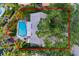 Overhead view of the property highlighting the pool and the surrounding lot with mature trees at 3960 13Th Ne Way, St Petersburg, FL 33703