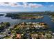 Stunning aerial view of waterfront homes and condos in the area with a beautiful bay and blue skies at 3960 13Th Ne Way, St Petersburg, FL 33703
