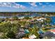 Aerial view of a home with a private pool surrounded by lush landscaping, showcasing a serene backyard oasis at 3960 13Th Ne Way, St Petersburg, FL 33703