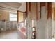 Partially renovated bathroom, featuring a classic pink bathtub and natural light at 3960 13Th Ne Way, St Petersburg, FL 33703
