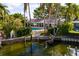 The canal-front home has a private pool, dock, and serene views of the water and lush greenery at 3960 13Th Ne Way, St Petersburg, FL 33703