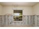 Living room showcasing a large window overlooking the canal and outdoor seating area awaiting renovation at 3960 13Th Ne Way, St Petersburg, FL 33703