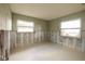 Bright living space ready for renovation, featuring natural light from large windows and blank canvas for new design at 3960 13Th Ne Way, St Petersburg, FL 33703