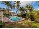 Inviting pool surrounded by lush tropical landscaping, offering a private and tranquil outdoor oasis at 3960 13Th Ne Way, St Petersburg, FL 33703