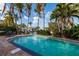 The pristine pool offers a peaceful retreat with views of the tranquil canal and surrounding greenery at 3960 13Th Ne Way, St Petersburg, FL 33703