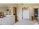 Bedroom view showing ensuite bathroom and closet with a floral painting detail at 4221 W Spruce St # 2205, Tampa, FL 33607