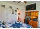 Comfortable bedroom setup with a desk, computer, and decoratively adorned walls at 4221 W Spruce St # 2205, Tampa, FL 33607