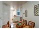 Open concept dining area near the kitchen, showcasing a wooden dining set and decor at 4221 W Spruce St # 2205, Tampa, FL 33607