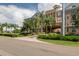 Stunning building exterior with vibrant landscaping and a circular driveway at 4221 W Spruce St # 2205, Tampa, FL 33607