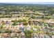 High aerial view of a community near a golf course, showcasing streets and housing at 5140 Kirkwood Ave, Spring Hill, FL 34608