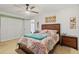 Bedroom with ceiling fan, closet, and neutral paint at 5140 Kirkwood Ave, Spring Hill, FL 34608